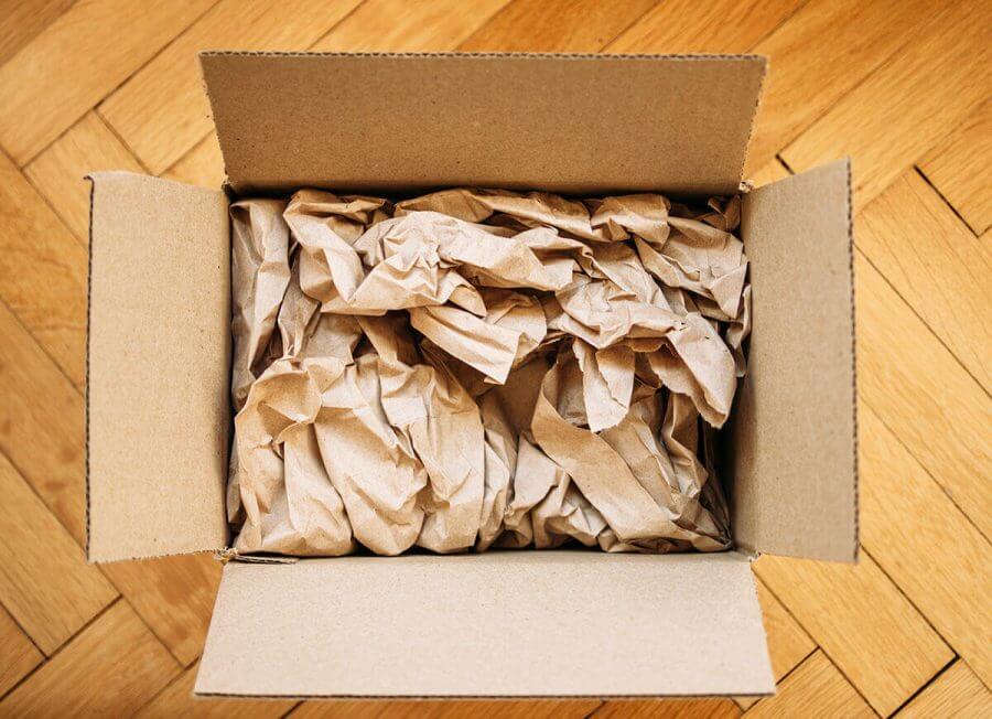 a box full of packing paper for cross-country moving