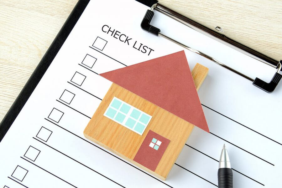 A checklist with a house
