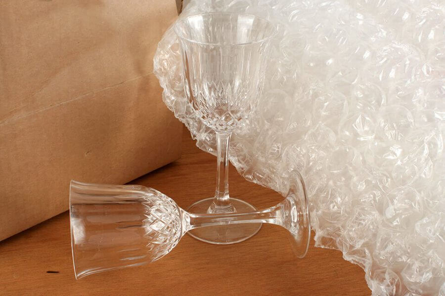 Glasses next to some bubble wrap