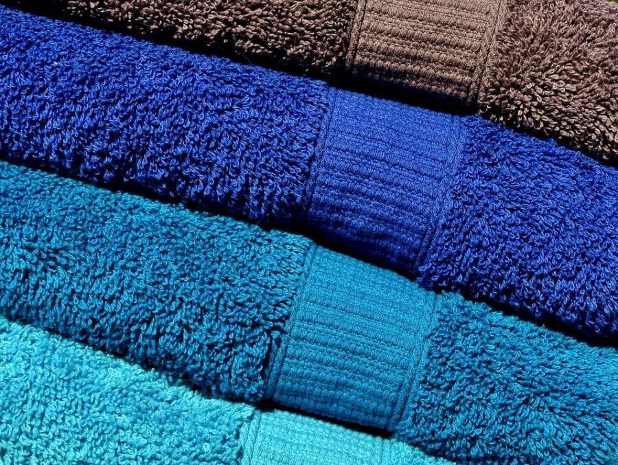 Numerous towels of different colors.