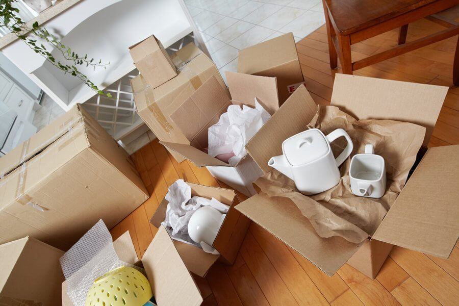 Boxes with dishes on the floor