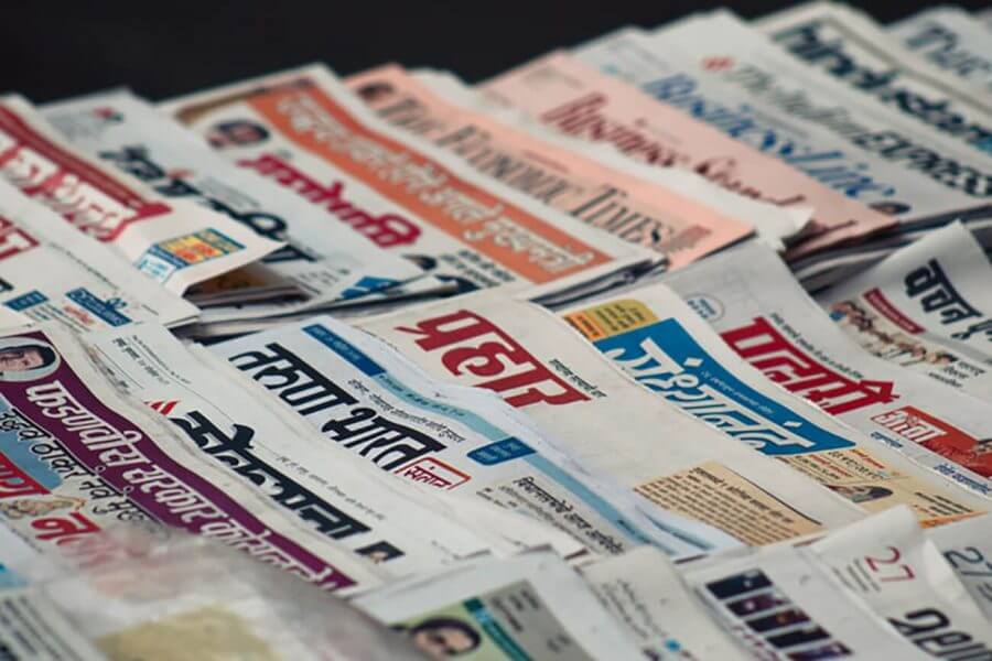 Assorted newspapers.