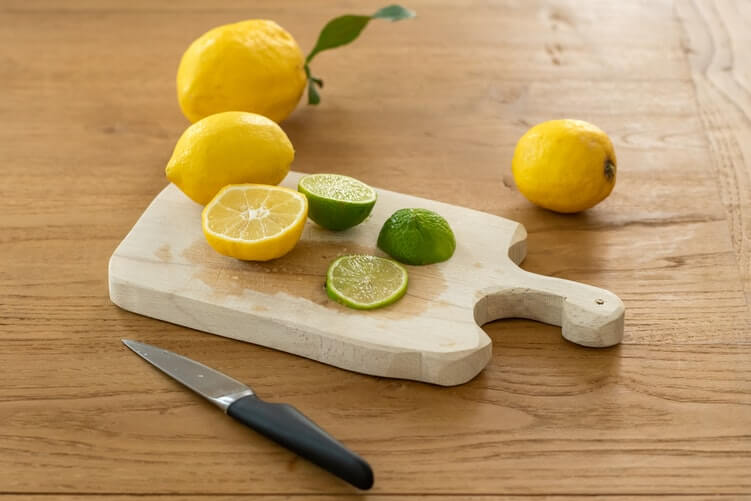 sliced limes on a cutting board