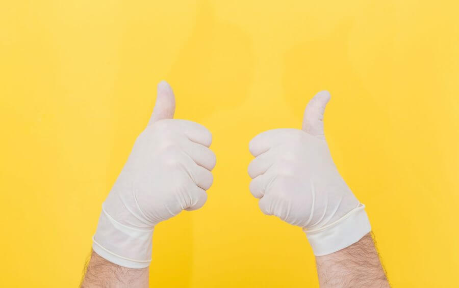thumbs up in rubber gloves