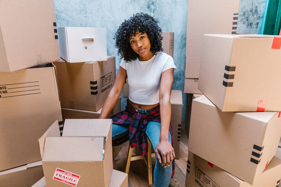 girl surrounded by boxes