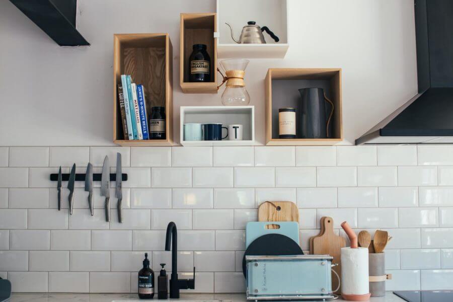 Kitchen items organized on the wall and shelves
