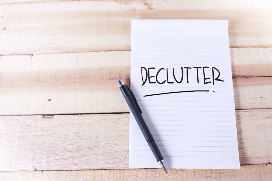  A pen and paper with 'declutter' written on it 