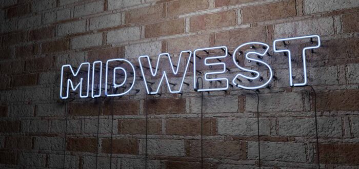 MIDWEST - Glowing Neon Sign on stonework wall - 3D rendered royalty free stock illustration. Can be used for online banner ads and direct mailers.