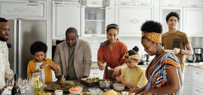 family preparing food in kitchen