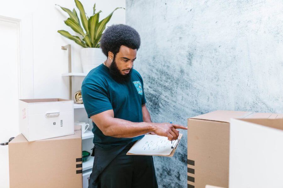 Professional mover checking inventory