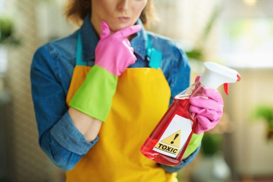 Woman looking at a cleaning product