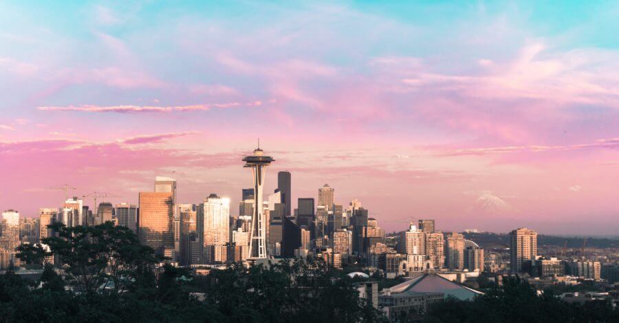 A view of the buildings and pink sky in Seattle