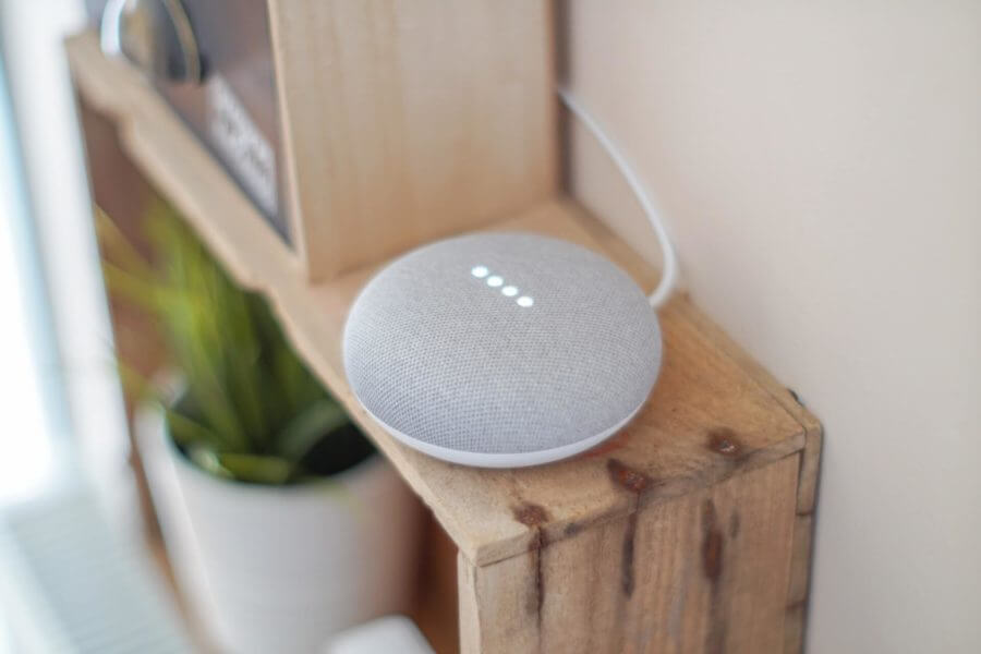 Round smart speaker on a shelf