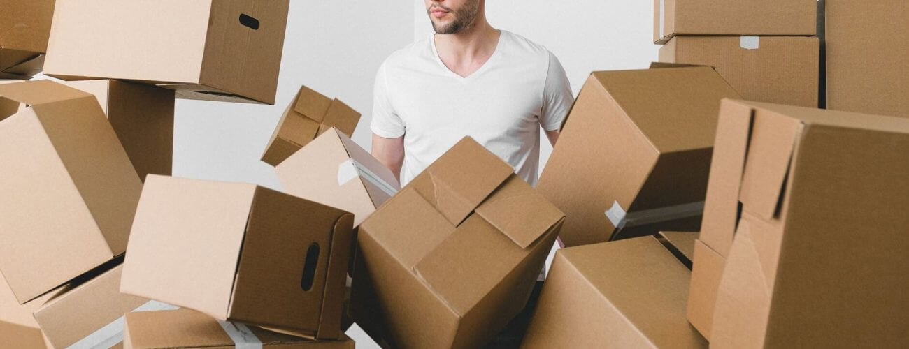 A man surrounded by boxes