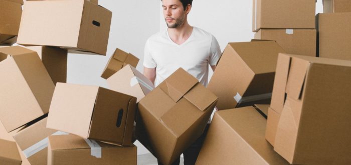 A man surrounded by boxes