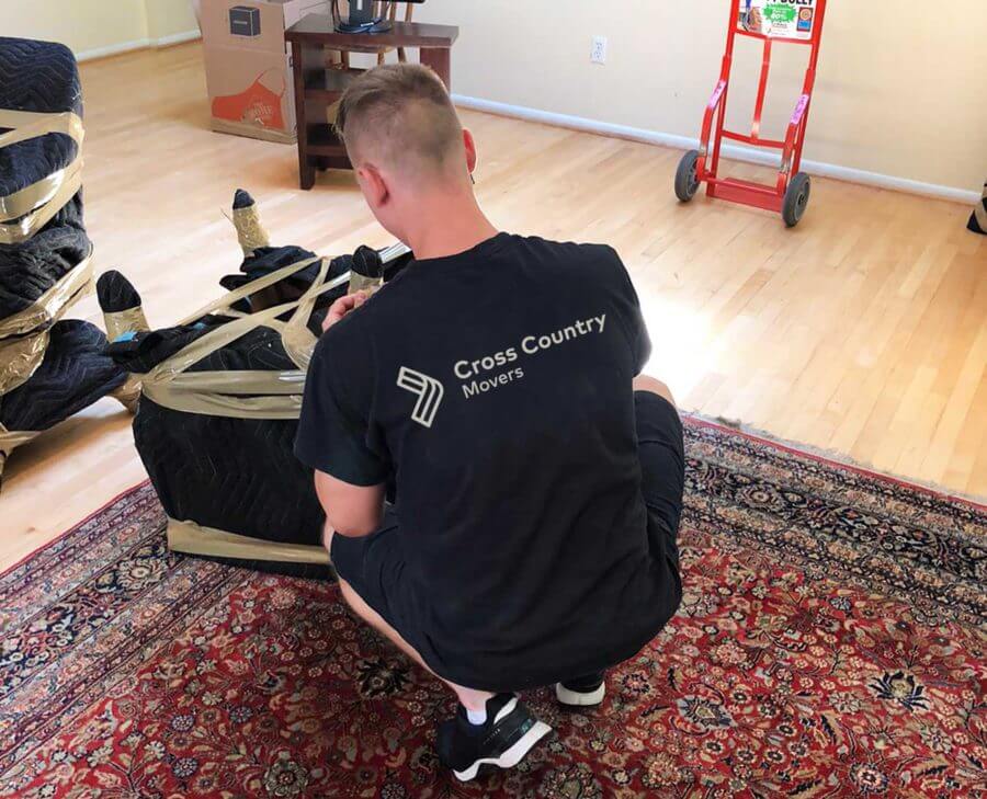 Professional mover securing a chair