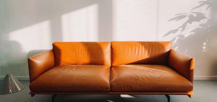 An orange sofa in a room