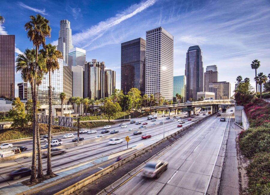 View of the street in Los Angeles with palms and skyscrapers
