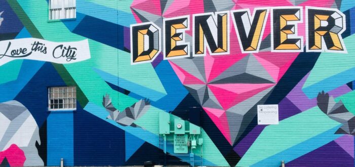 A colorful mural that says Denver
