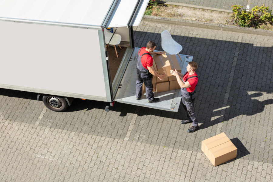 Cross-country movers loading a truck