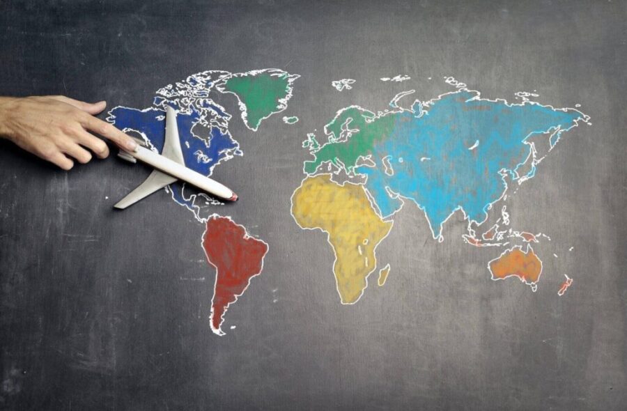 A toy plane on a world map 