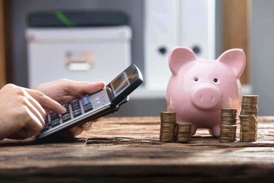 A calculator and a piggy bank