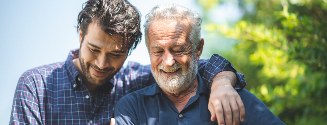 A man talking to his father after moving across the country