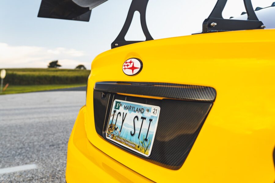 USA car plates on a yellow car 