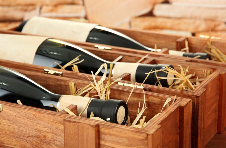  Wine bottles laid down in custom wooden crates