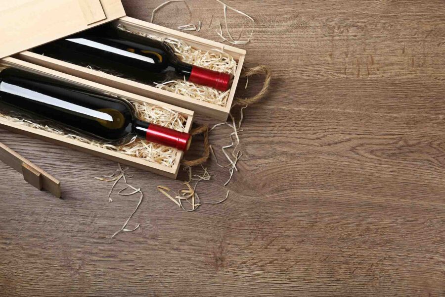 Wine bottles inside wooden crates before cross-country moving