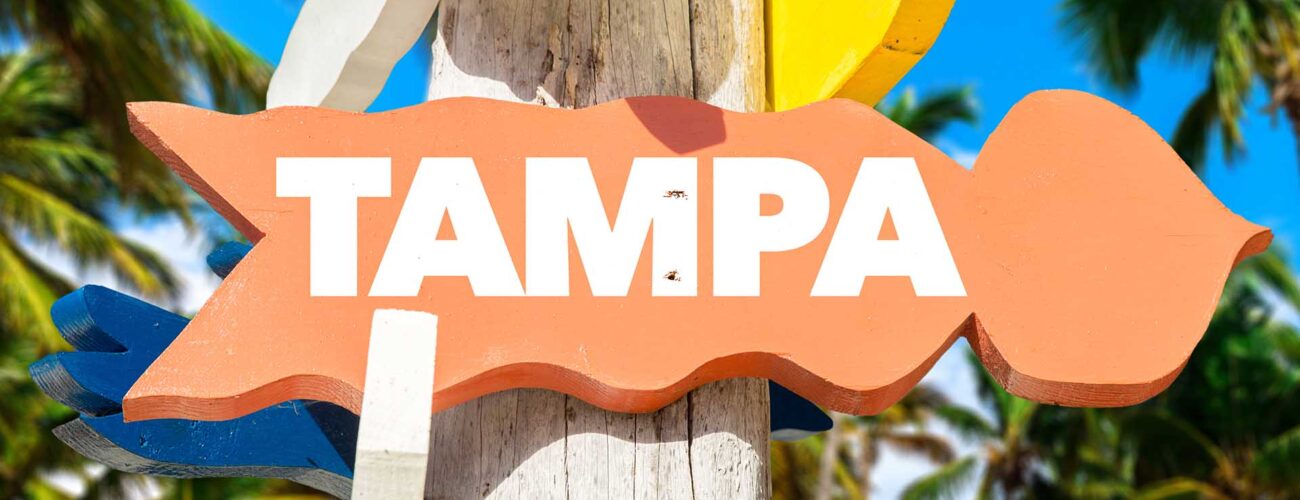 An orange sign with Tampa written on it