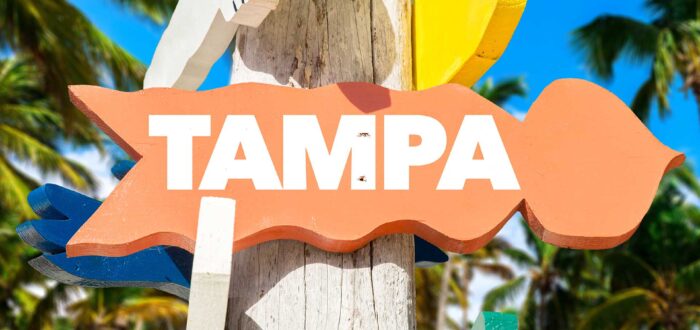 An orange sign with Tampa written on it