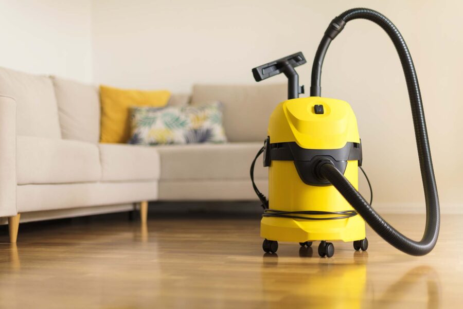 Yellow modern vacuum cleaner in the living room