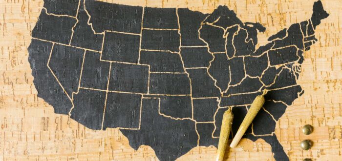 Map with US states on a wooden surface