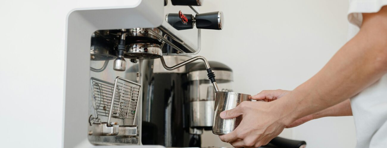 A person using an espresso machine