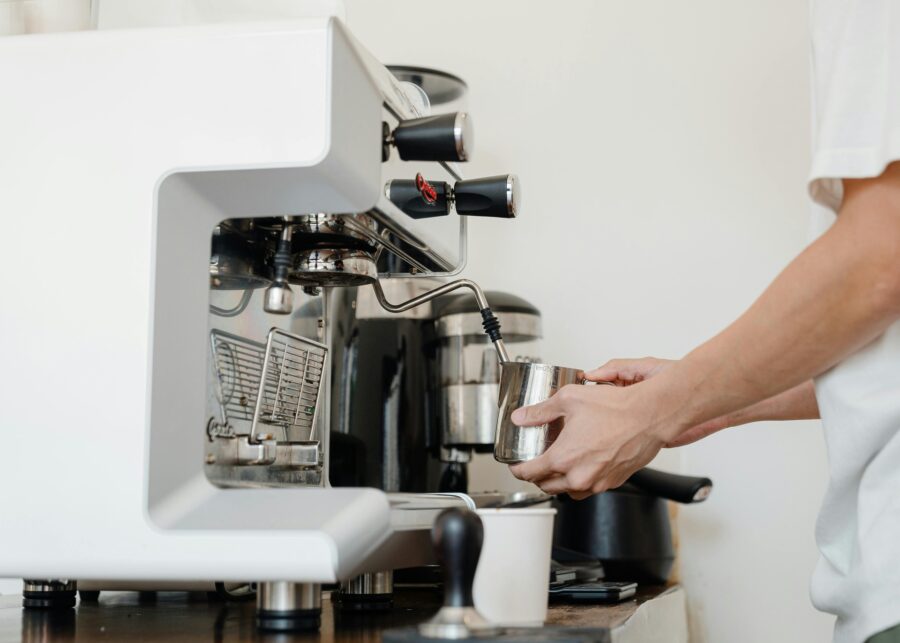 A person using an espresso machine 