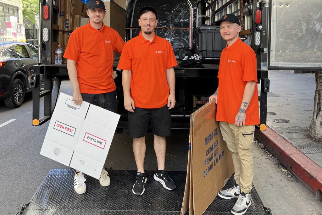 Cross Country Movers in front of the truck Brand