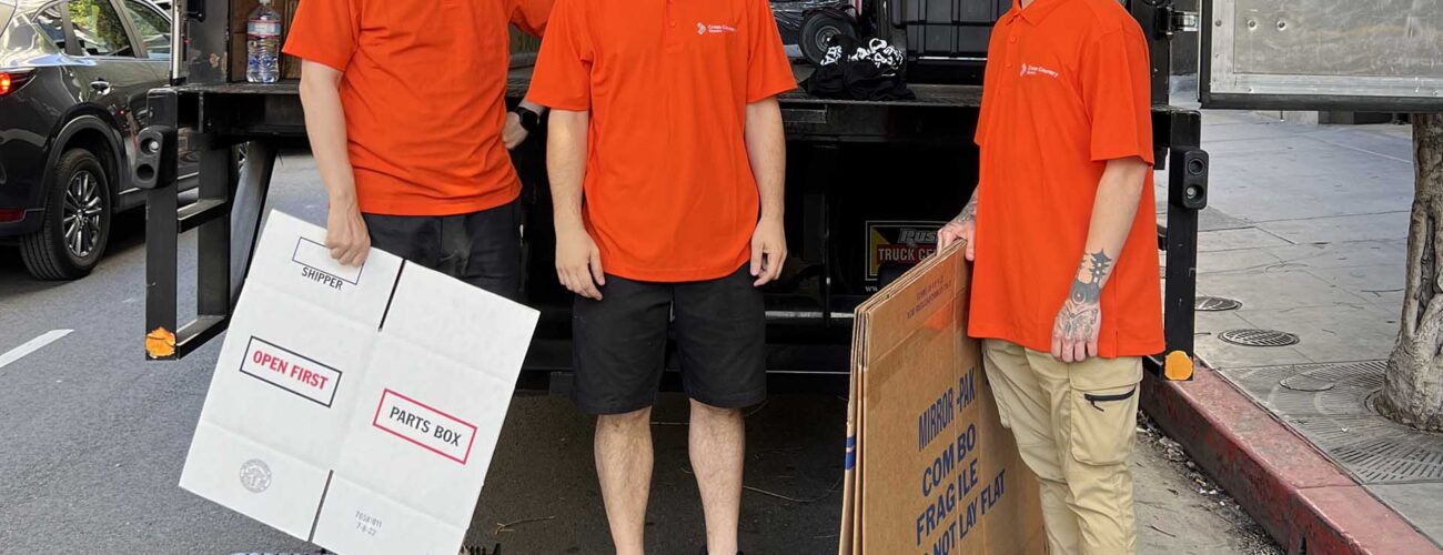 Cross Country Movers in front of the truck Brand