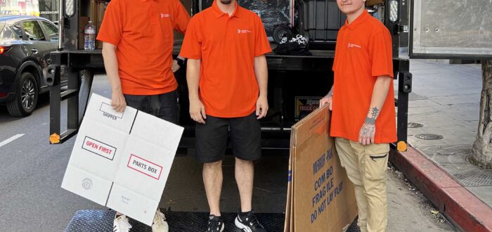 Cross Country Movers in front of the truck Brand