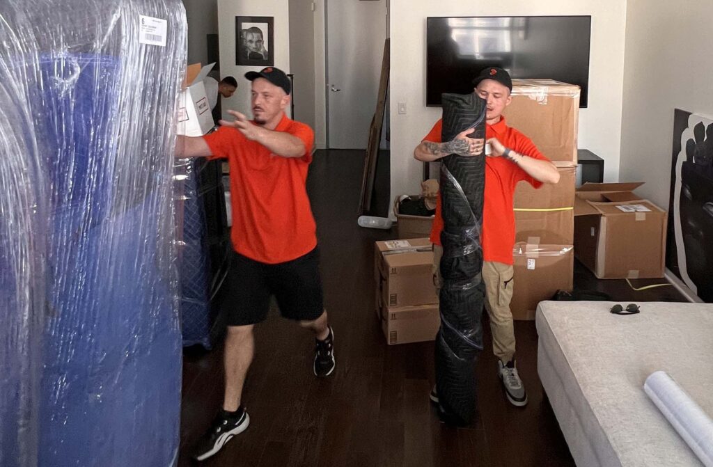 Cross Country Movers packing items in the room Brand