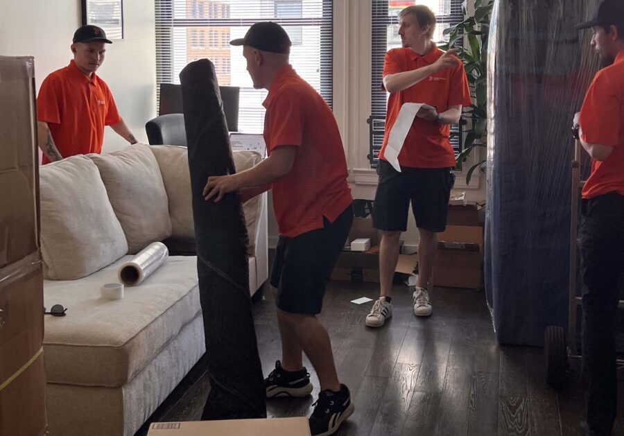 Cross Country Movers taking furniture to the truck