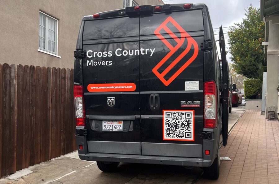 Cross Country Movers van parked in front of the house Brand