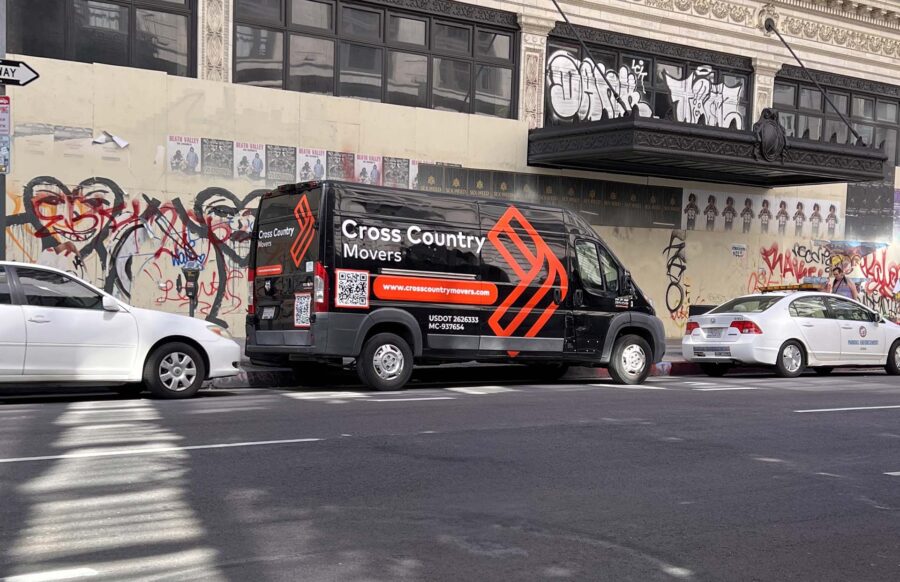 Cross Country Movers van parked on the street Brand