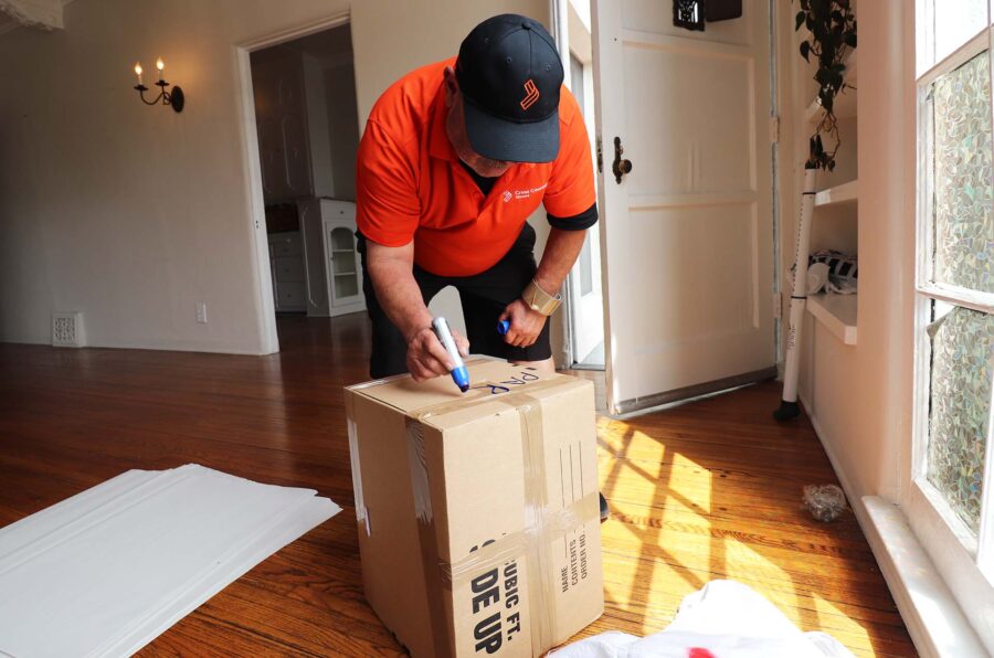 A mover labeling a box