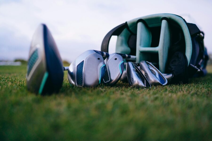 Golf clubs in a bag on the grass