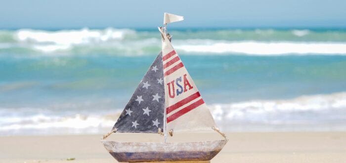 A small toy boat on the beach