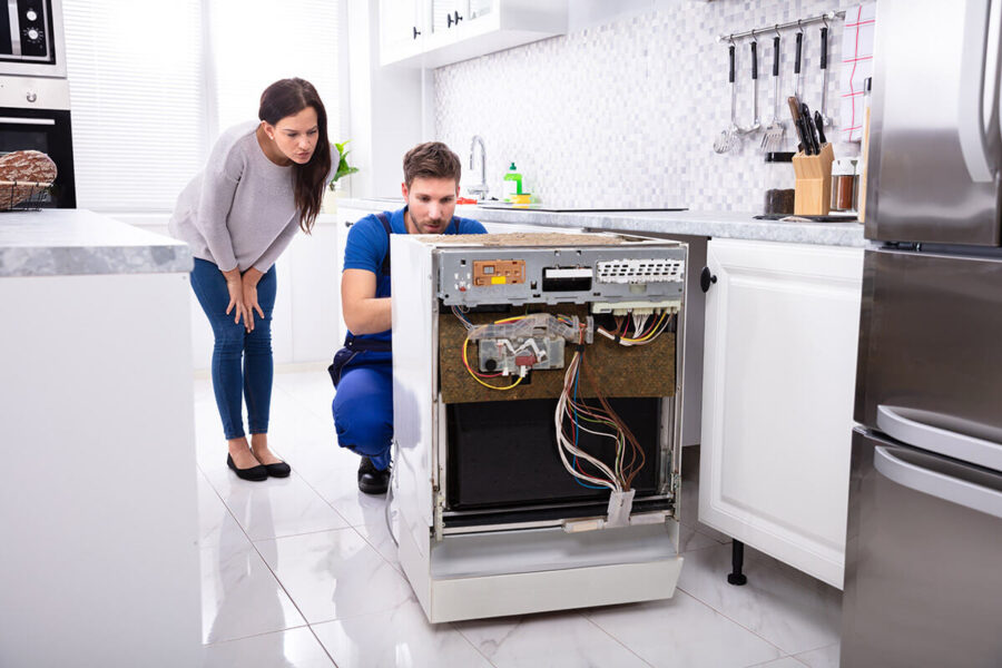 A technician checking an oven after long-distance moving