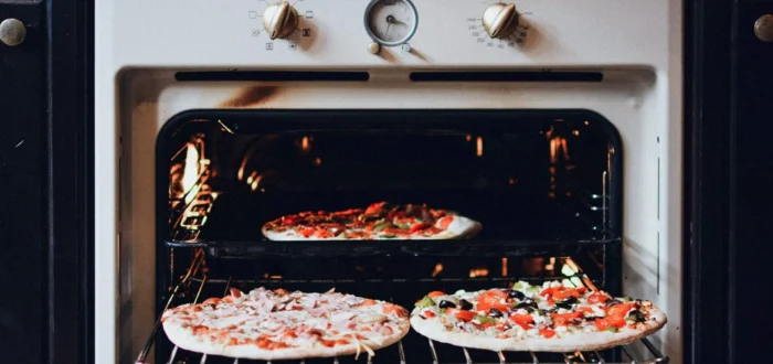 A pizza in an oven after cross-country moving