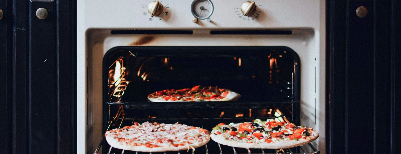 A pizza in an oven after cross-country moving