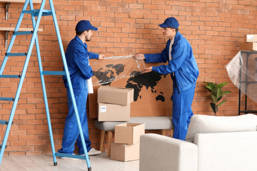 Professional movers packing furniture